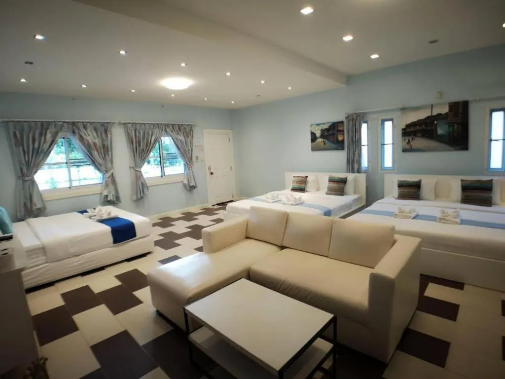 Bed in Chiangkhan Gallery Resort