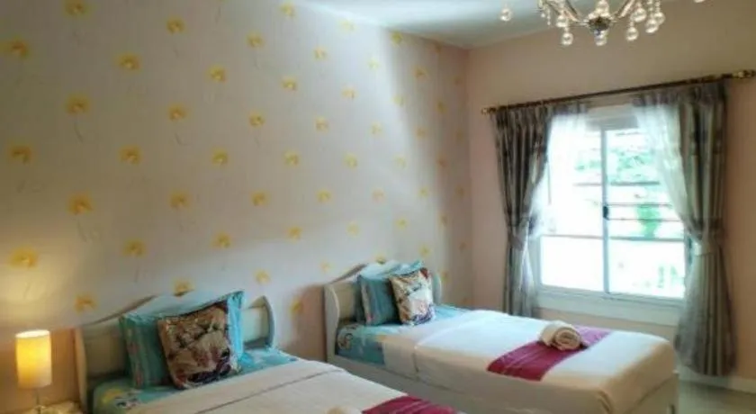 Bed in Chiangkhan Gallery Resort