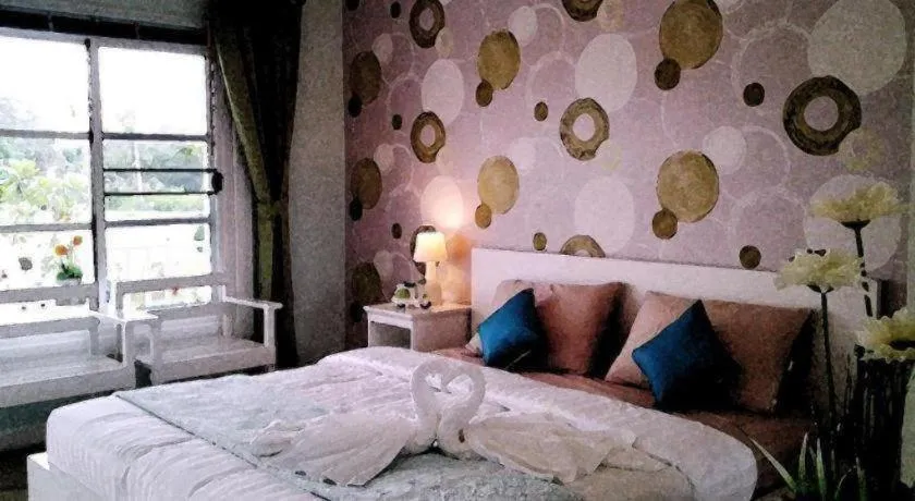 Bed in Chiangkhan Gallery Resort