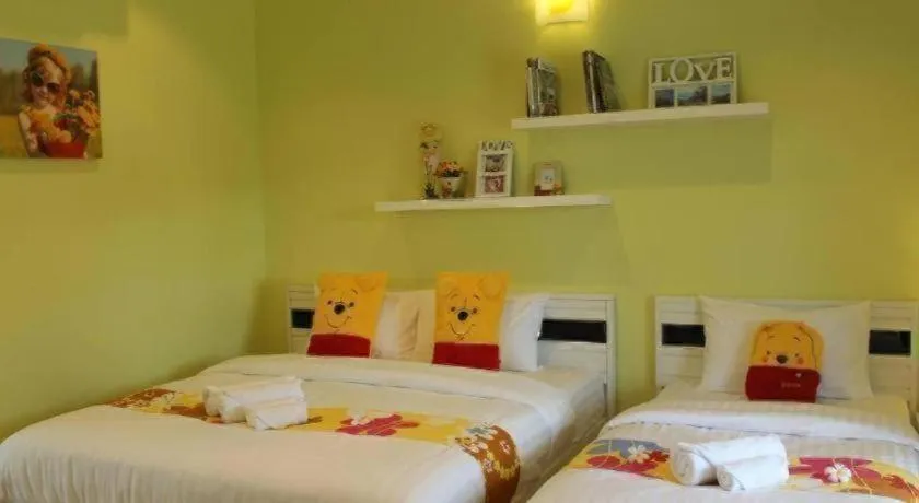 Bed in Chiangkhan Gallery Resort