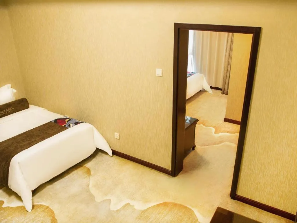 Bed in James Joyce Coffetel Qinhuangdao Taiyangcheng Wenhua Road