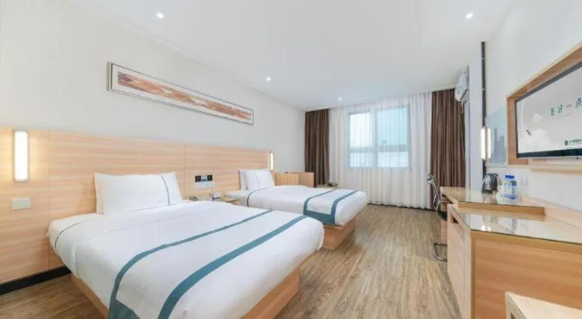 Bed in City Comfort Inn Yulin Wenhua Square Wanda Plaza