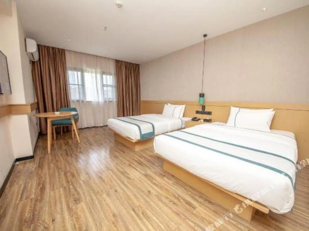 Bed in City Comfort Inn Yulin Wenhua Square Wanda Plaza