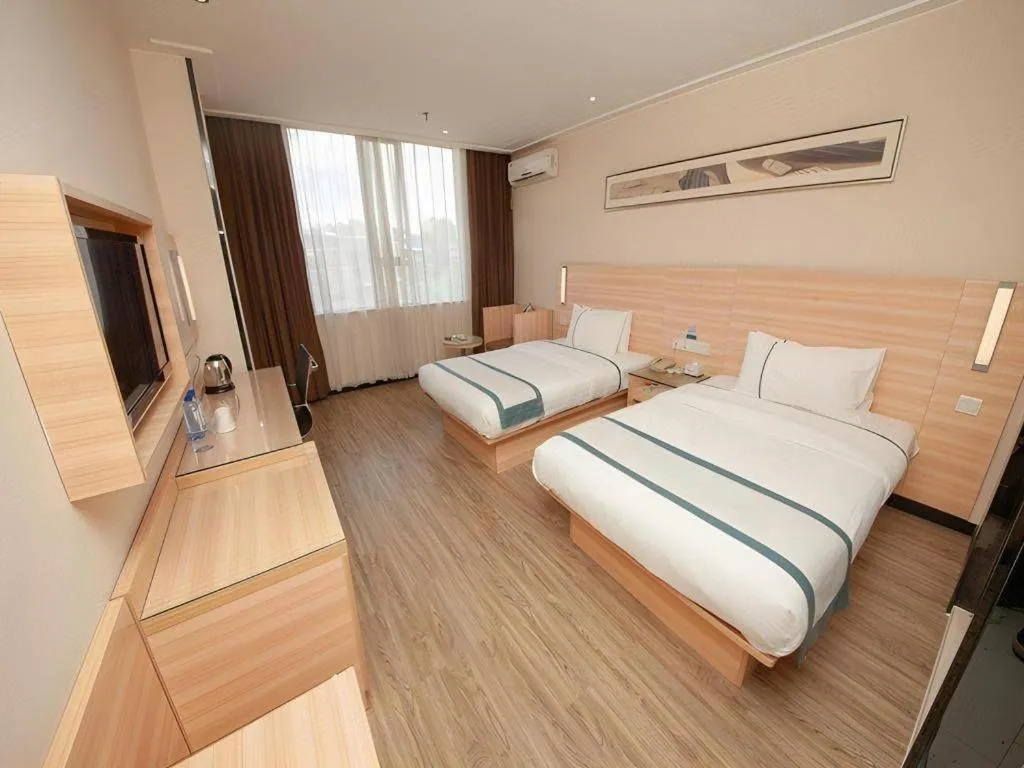 Bed in City Comfort Inn Yulin Wenhua Square Wanda Plaza