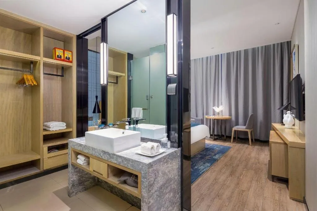 Bed in Echarm Hotel Danzhou Xiari Plaza