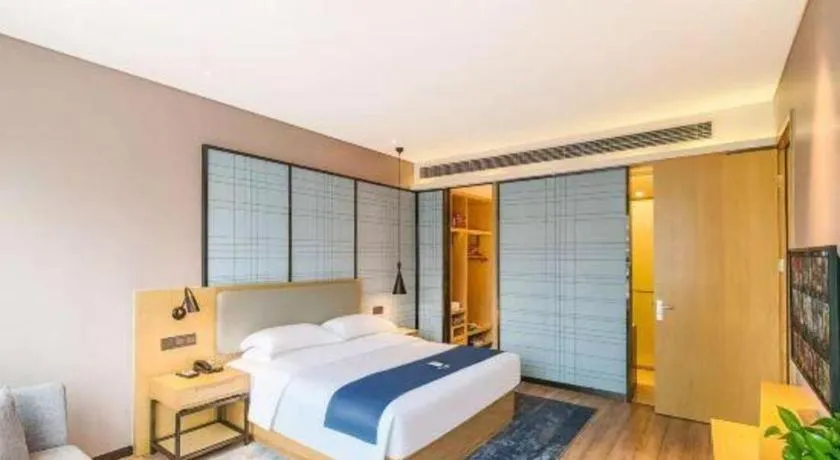 Bed in Echarm Hotel Danzhou Xiari Plaza