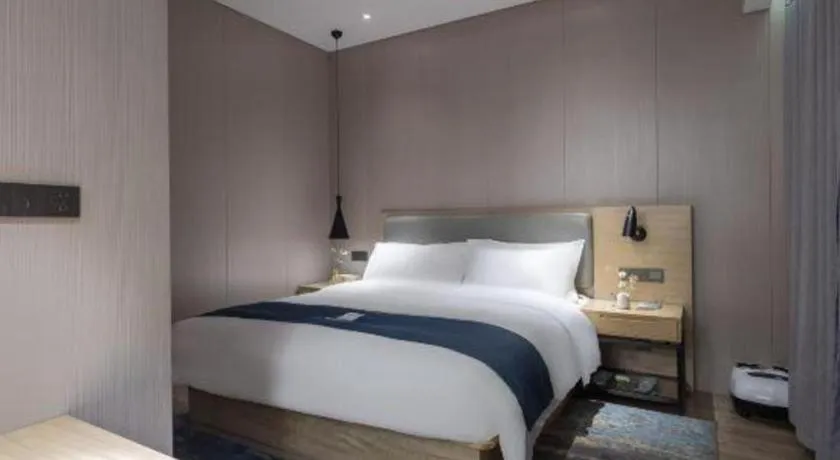 Bed in Echarm Hotel Danzhou Xiari Plaza