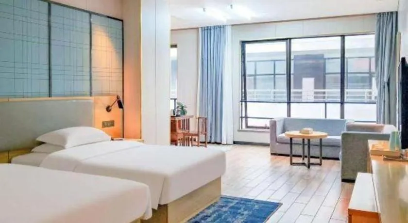 Bed in Echarm Hotel Danzhou Xiari Plaza