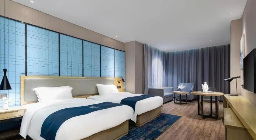 Bed in Echarm Hotel Danzhou Xiari Plaza