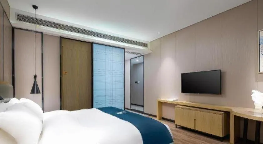 Bed in Echarm Hotel Danzhou Xiari Plaza