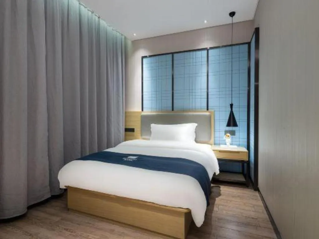 Bed in Echarm Hotel Danzhou Xiari Plaza