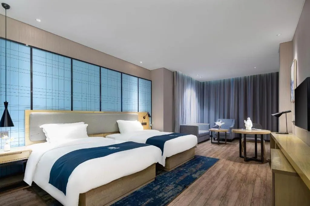 Bed in Echarm Hotel Danzhou Xiari Plaza