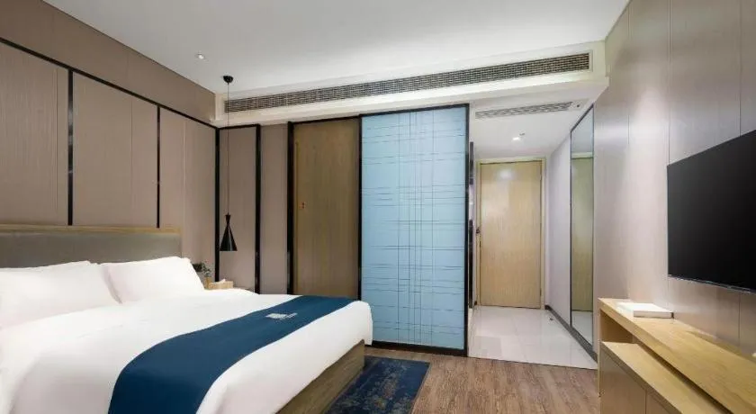 Bed in Echarm Hotel Danzhou Xiari Plaza