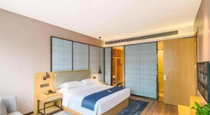 Bed in Echarm Hotel Danzhou Xiari Plaza