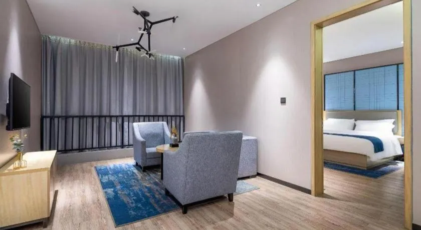 Bed in Echarm Hotel Danzhou Xiari Plaza