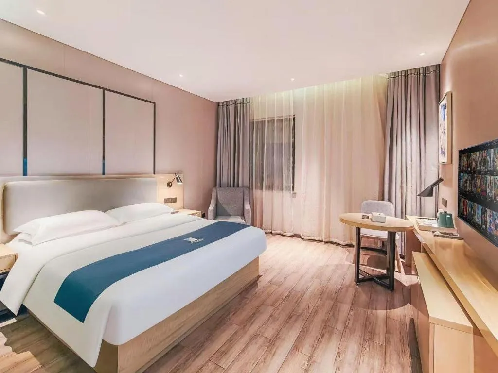 Bed in Echarm Hotel Danzhou Xiari Plaza