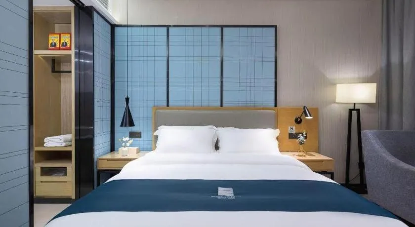 Bed in Echarm Hotel Danzhou Xiari Plaza