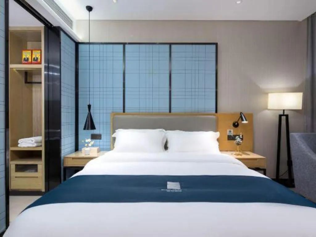 Bed in Echarm Hotel Danzhou Xiari Plaza