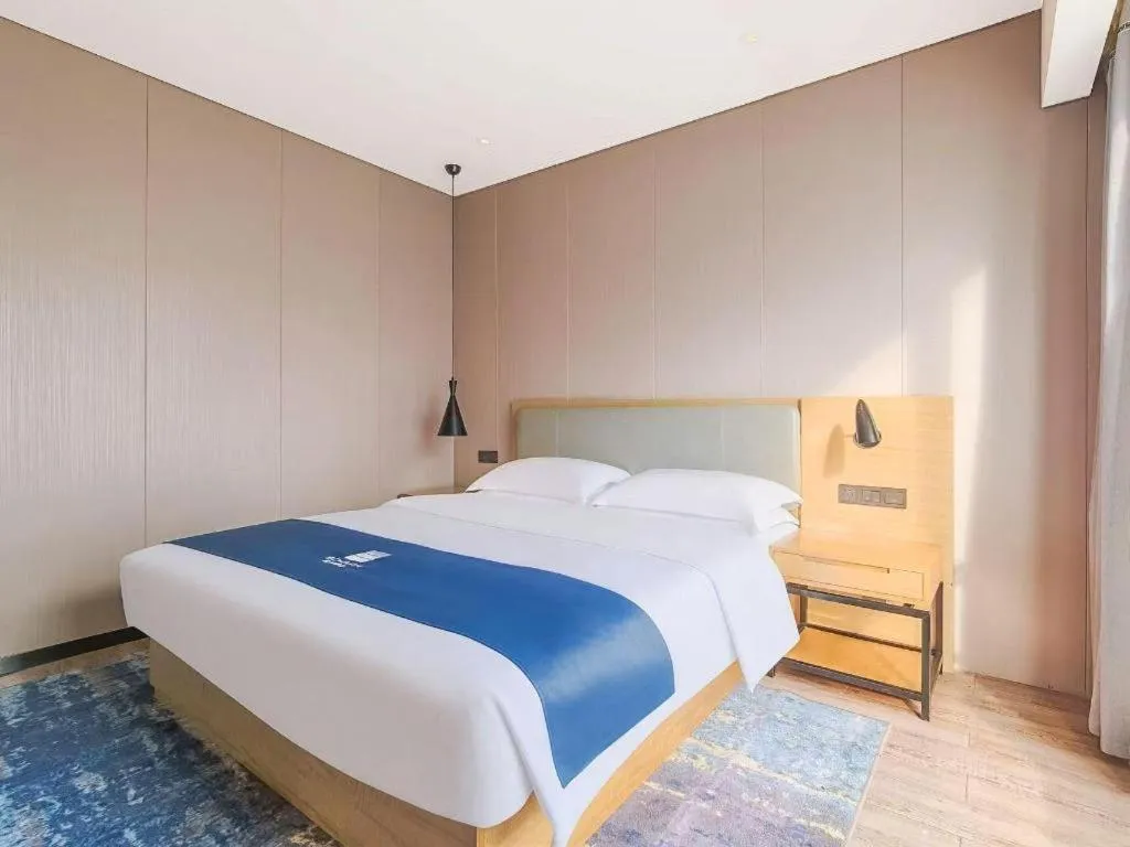 Bed in Echarm Hotel Danzhou Xiari Plaza