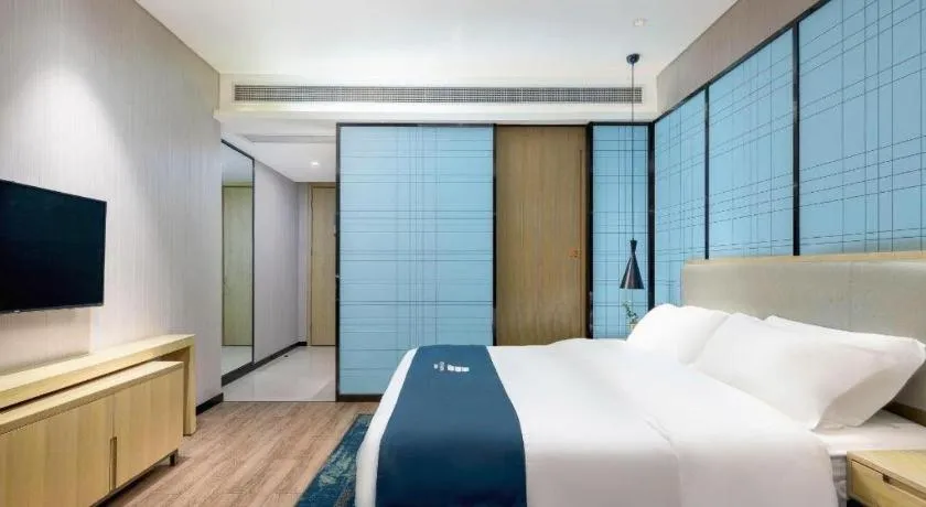 Bed in Echarm Hotel Danzhou Xiari Plaza