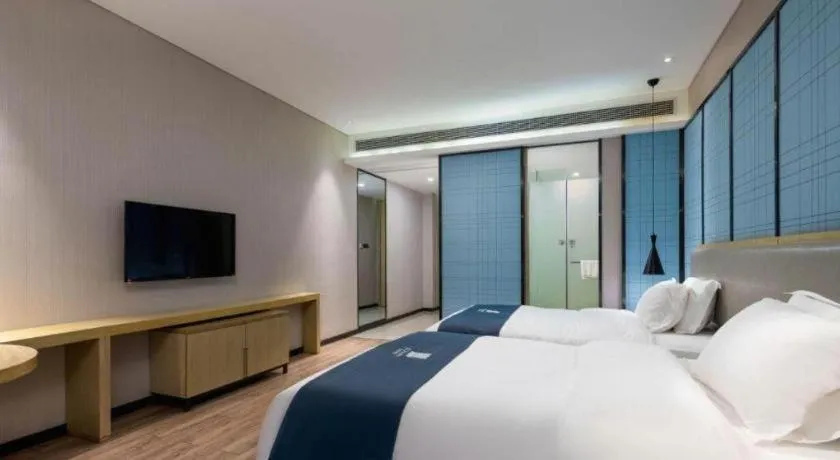 Bed in Echarm Hotel Danzhou Xiari Plaza