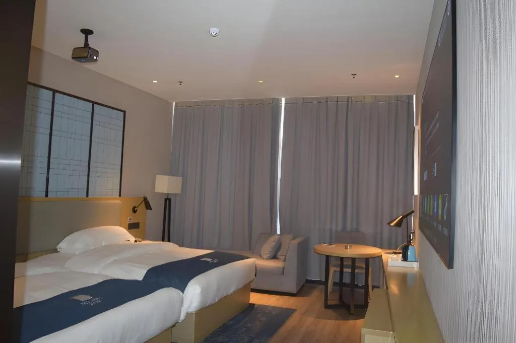 Bed in Echarm Hotel Danzhou Xiari Plaza