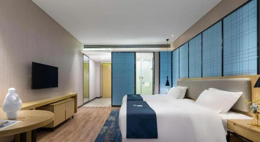 Bed in Echarm Hotel Danzhou Xiari Plaza