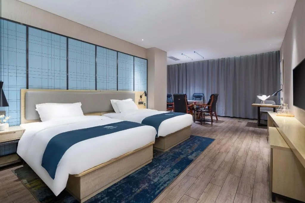 Bed in Echarm Hotel Danzhou Xiari Plaza