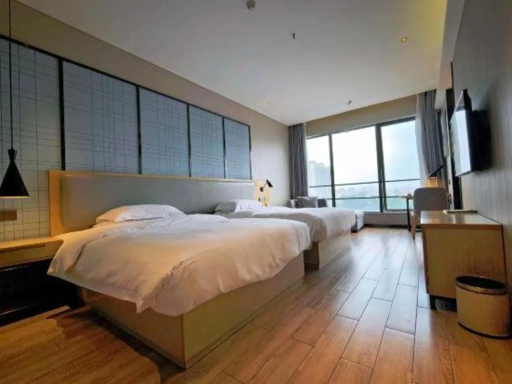 Bed in Echarm Hotel Danzhou Xiari Plaza