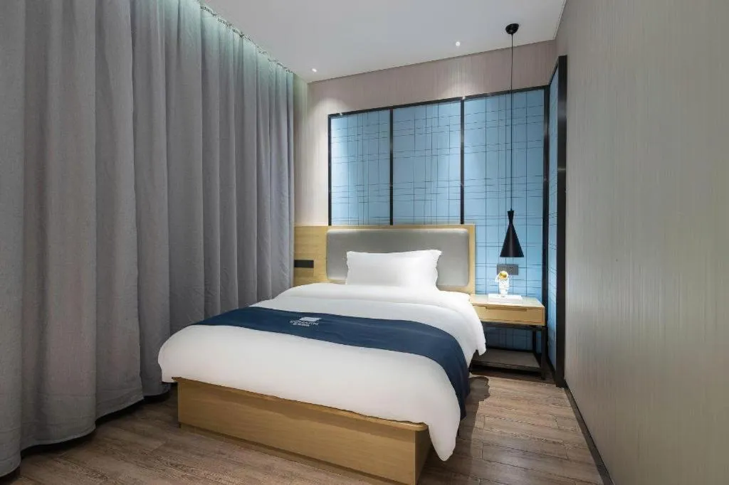 Bed in Echarm Hotel Danzhou Xiari Plaza