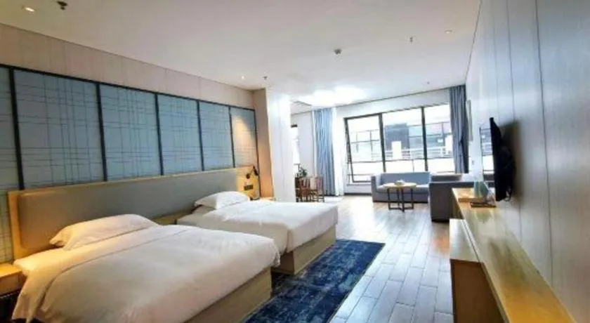 Bed in Echarm Hotel Danzhou Xiari Plaza
