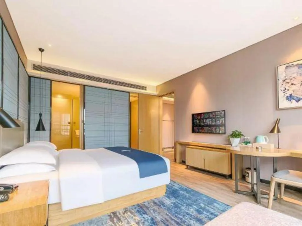 Bed in Echarm Hotel Danzhou Xiari Plaza
