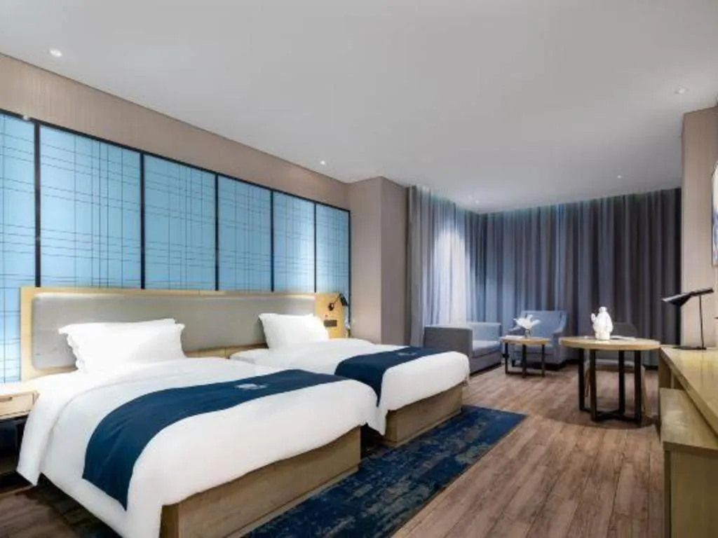 Bed in Echarm Hotel Danzhou Xiari Plaza