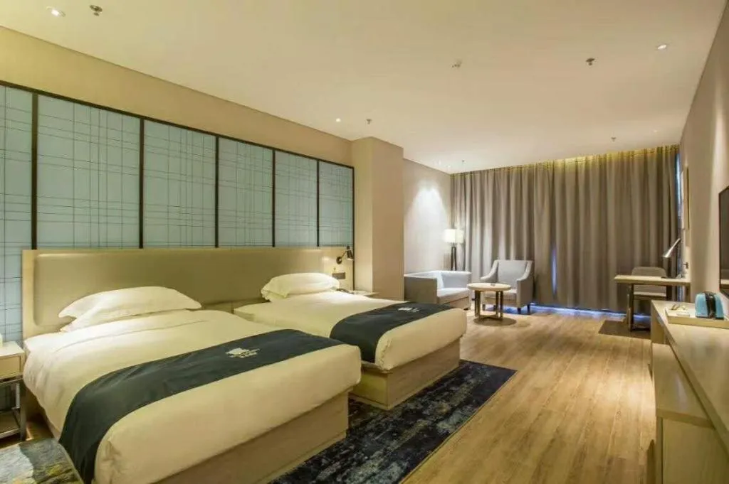 Bed in Echarm Hotel Danzhou Xiari Plaza