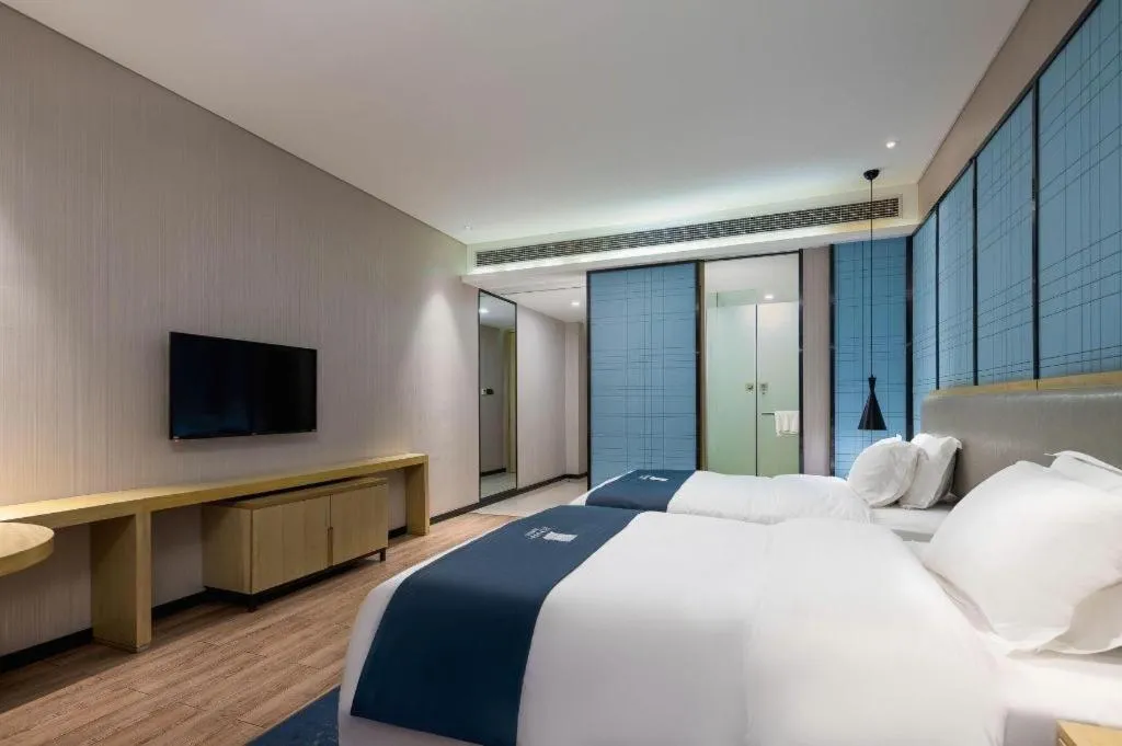 Bed in Echarm Hotel Danzhou Xiari Plaza