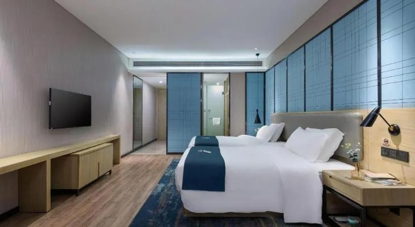 Bed in Echarm Hotel Danzhou Xiari Plaza