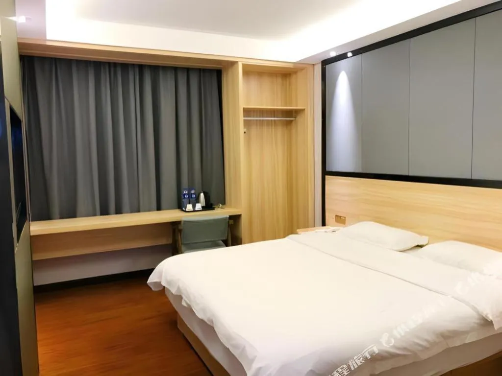 Bed in Wenxing Hotel Guangzhou Gangding Metro Station Branch