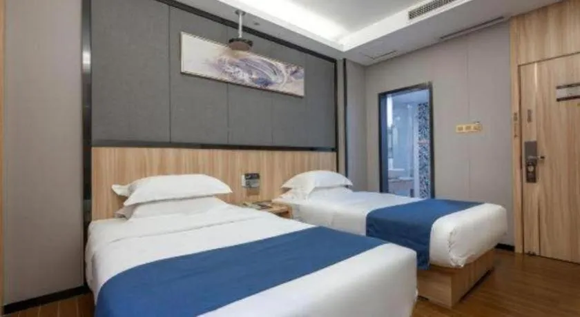 Bed in Wenxing Hotel Guangzhou Gangding Metro Station Branch