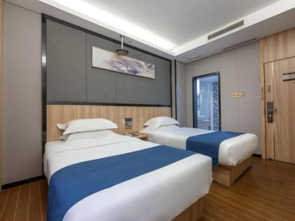 Bed in Wenxing Hotel Guangzhou Gangding Metro Station Branch