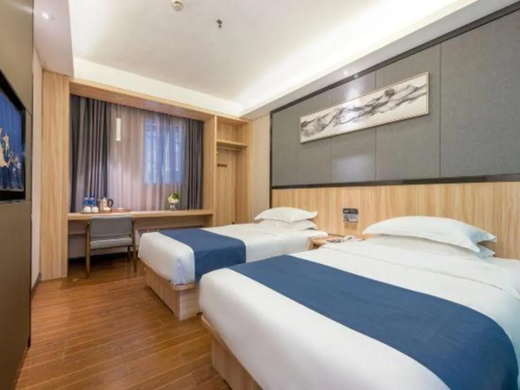 Bed in Wenxing Hotel Guangzhou Gangding Metro Station Branch