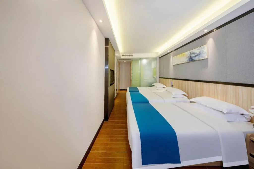 Bed in Wenxing Hotel Guangzhou Gangding Metro Station Branch