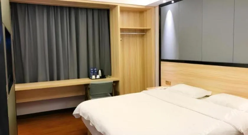 Bed in Wenxing Hotel Guangzhou Gangding Metro Station Branch
