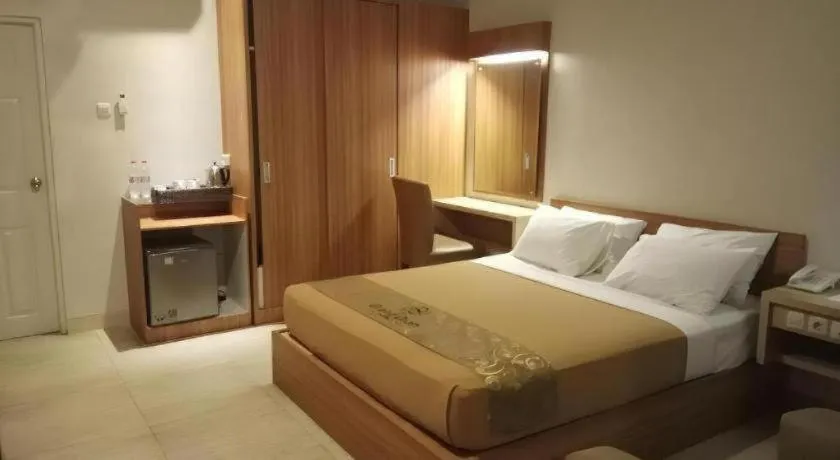 Bed in Grand Dian Hotel Slawi