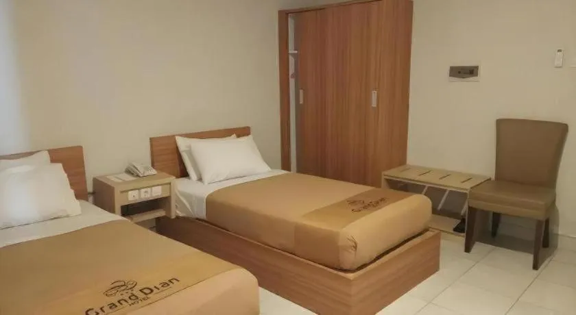 Bed in Grand Dian Hotel Slawi