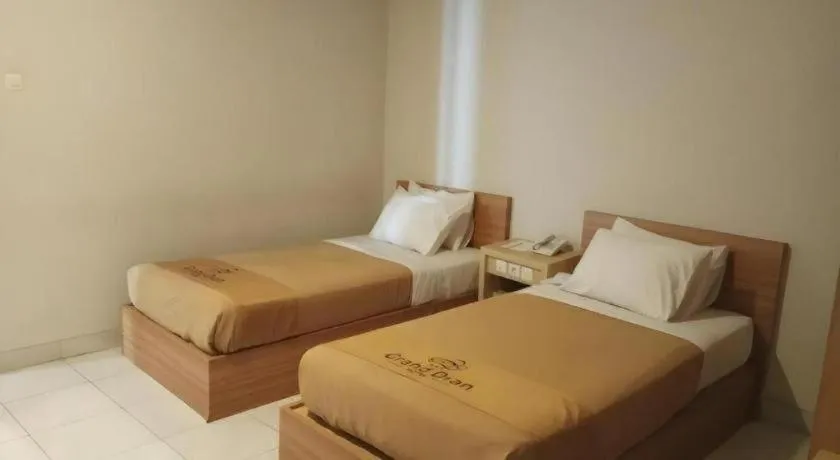 Bed in Grand Dian Hotel Slawi