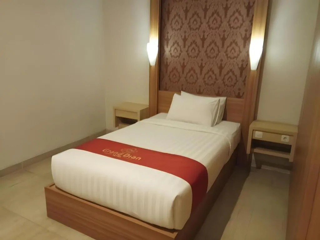 Bed in Grand Dian Hotel Slawi