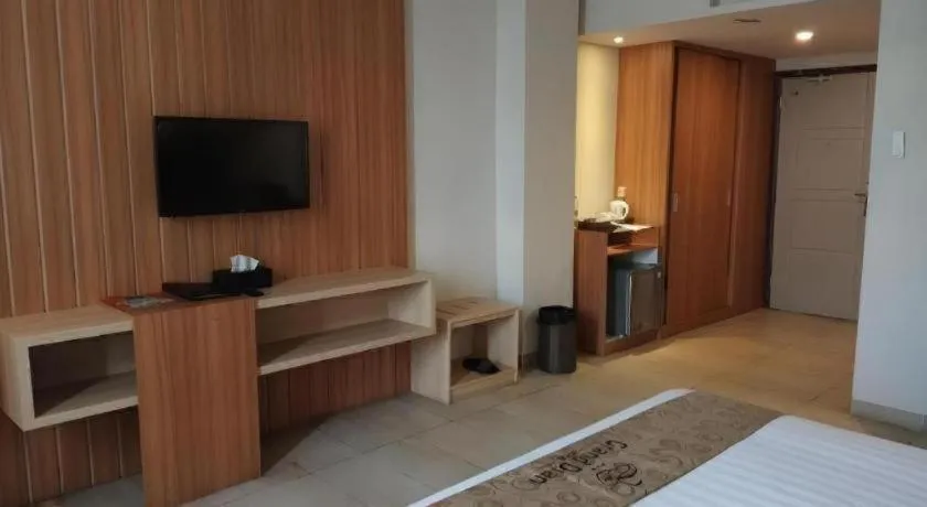 Bed in Grand Dian Hotel Slawi