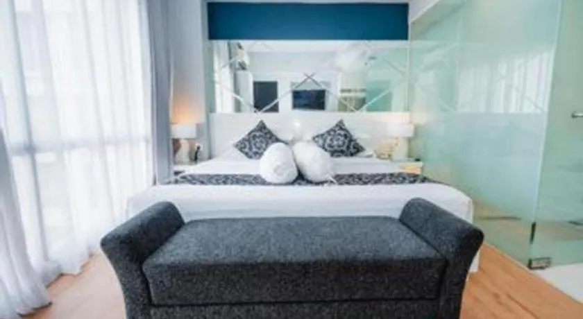 Bed in Grand Darmo Suite by AMITHYA