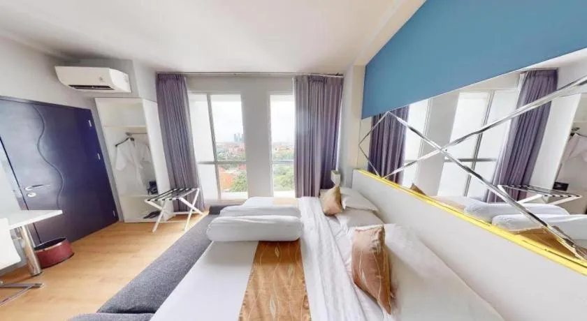 Bed in Grand Darmo Suite by AMITHYA