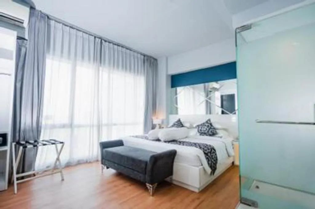 Bed in Grand Darmo Suite by AMITHYA